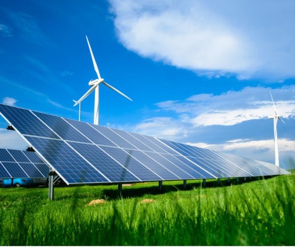 solar-energy-panels-and-windmills-against-blue-sky-on-summer-day-picture-id994140818 (2)